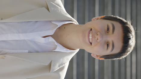 smiling person in beige jacket