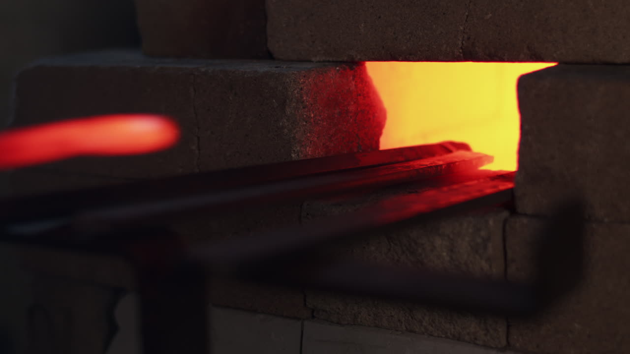 Metal rods sit in a furnace inferno as the fire heats up
