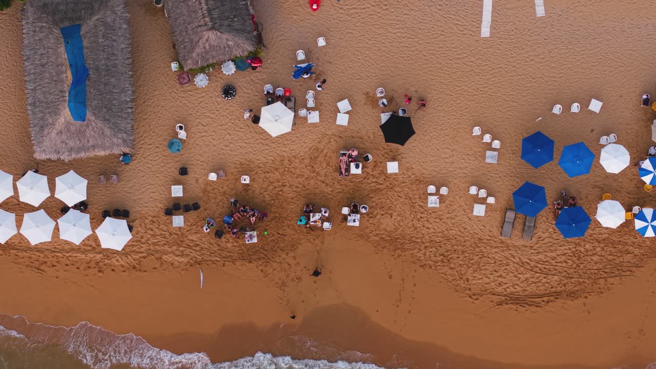 Top-down drone video highlighting beach in Acapulco