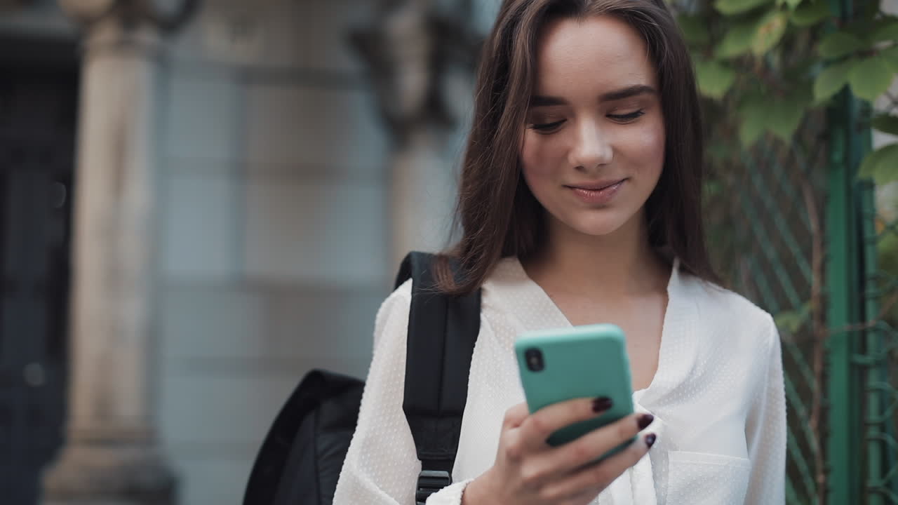 A woman using her smartphone outdoors
