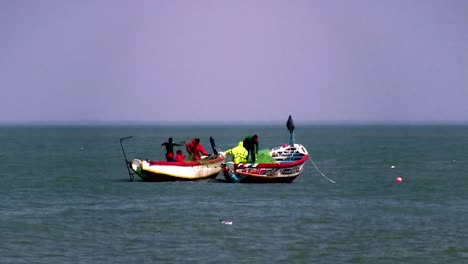 African Fishermen pulling in their nets at the end of a long day, close to shore.