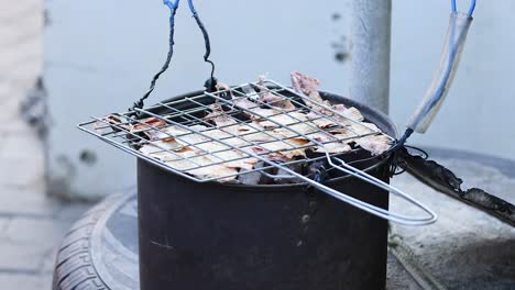 squid grilling on a street food setup