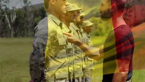 waving belgium flag against army sergeant screaming in anger on a soldier at training camp