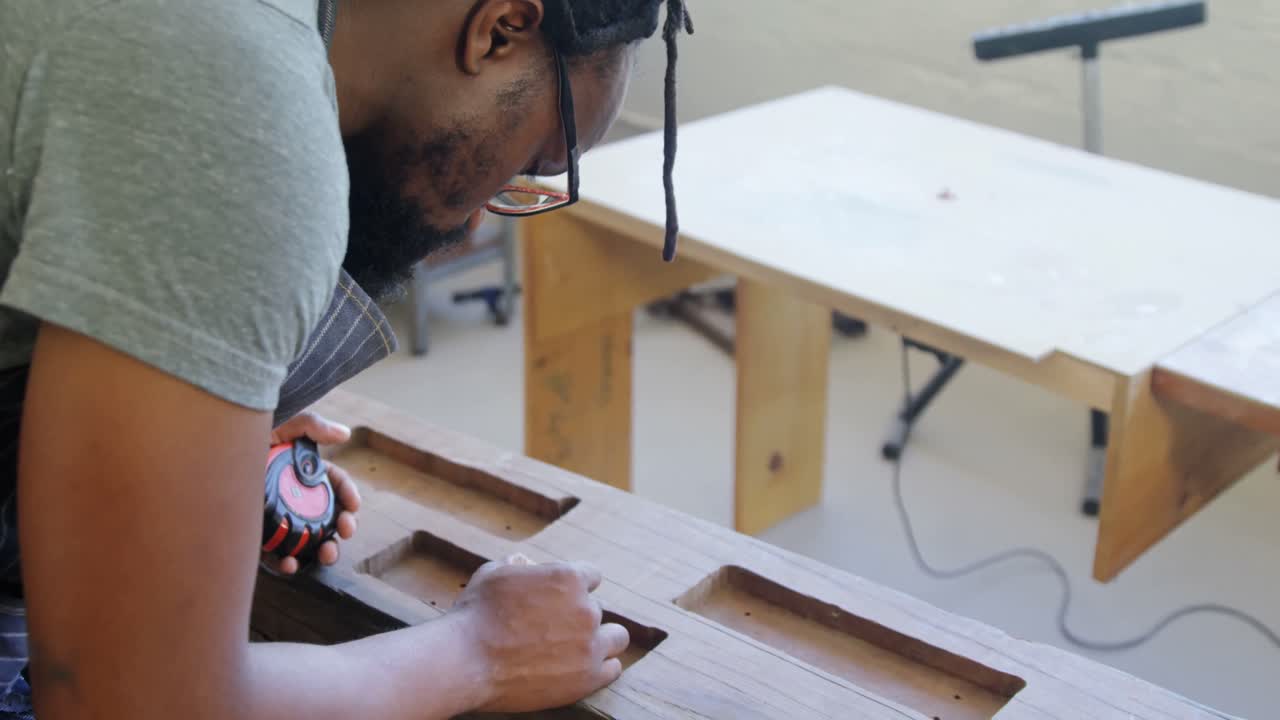 Carpenter marking with pencil on wood 4k