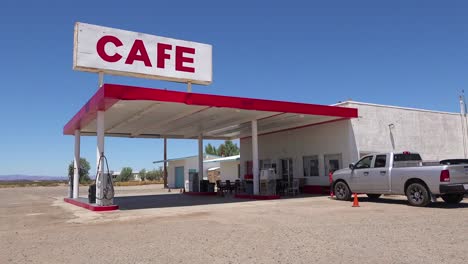 establishing shot of a lonely desert gas station and hotel motel cafe in the mojave desert 4