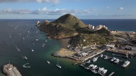 Cabo-San-Lucas,-Mexico,-cinematic-setting-over-marina-with-boats,-aerial-view