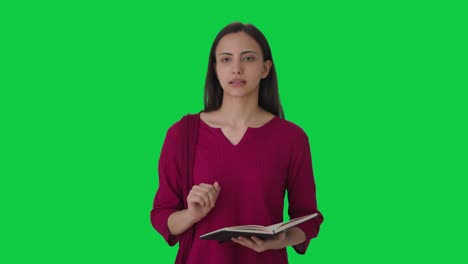 Indian-female-teacher-solving-student-problem-Green-screen