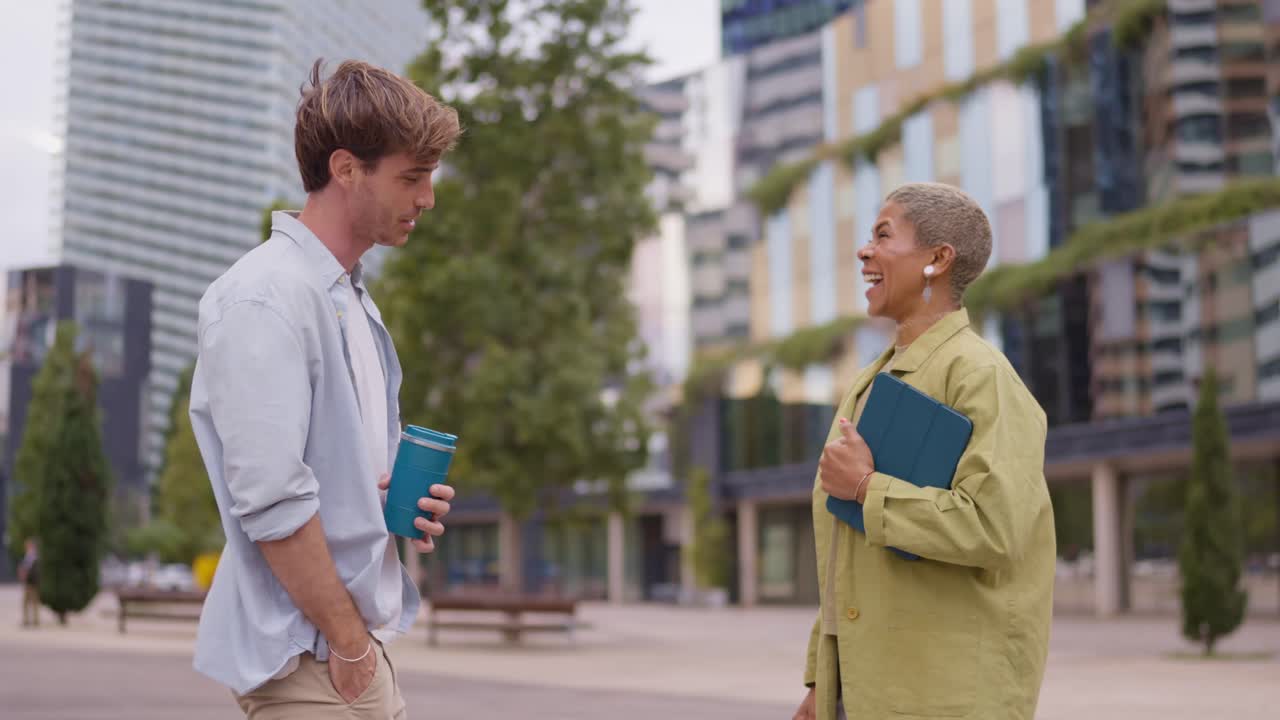 People having a conversation outdoors in an urban setting