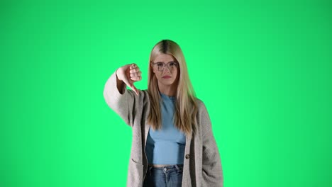 Caucasian-Blonde-Woman-Thumbs-Down-with-her-finger,-portrait-chroma-studio-shot