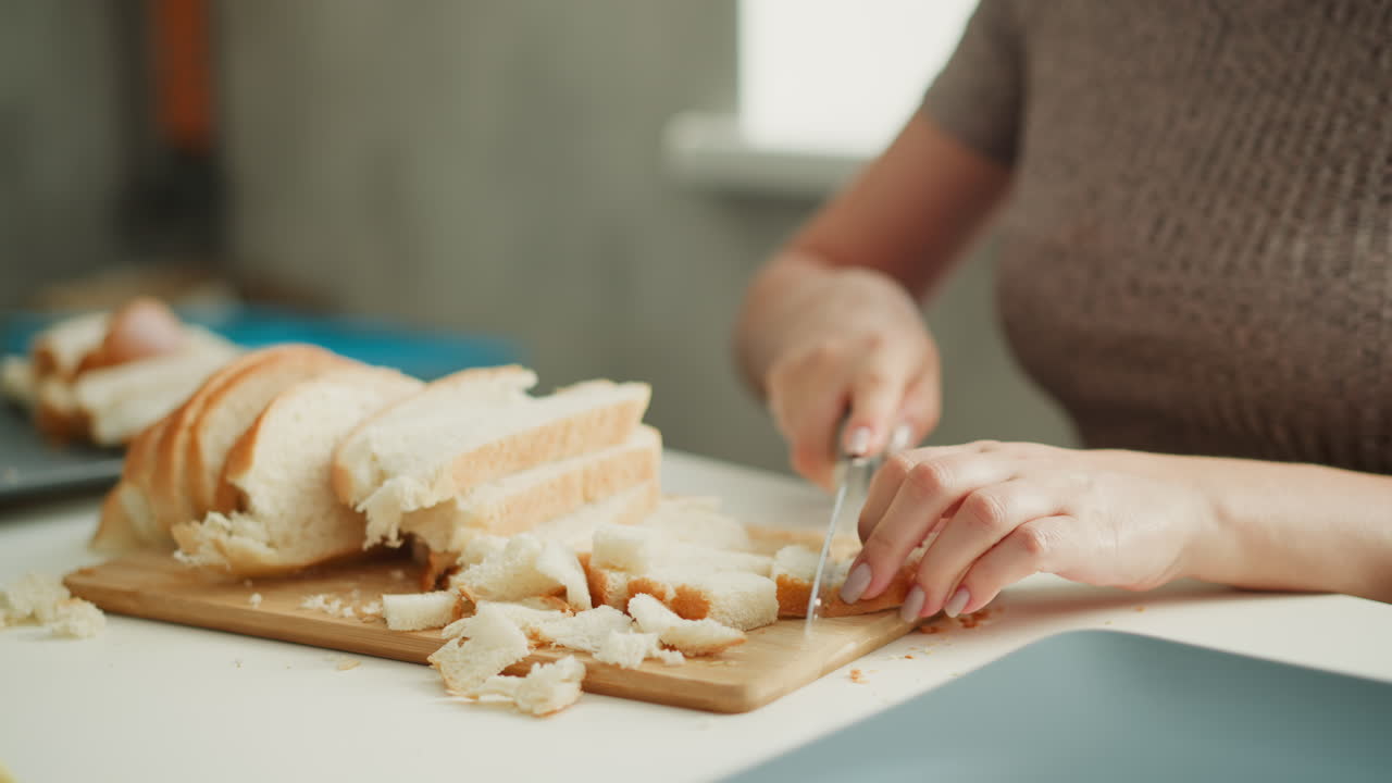 Woman cutting bread