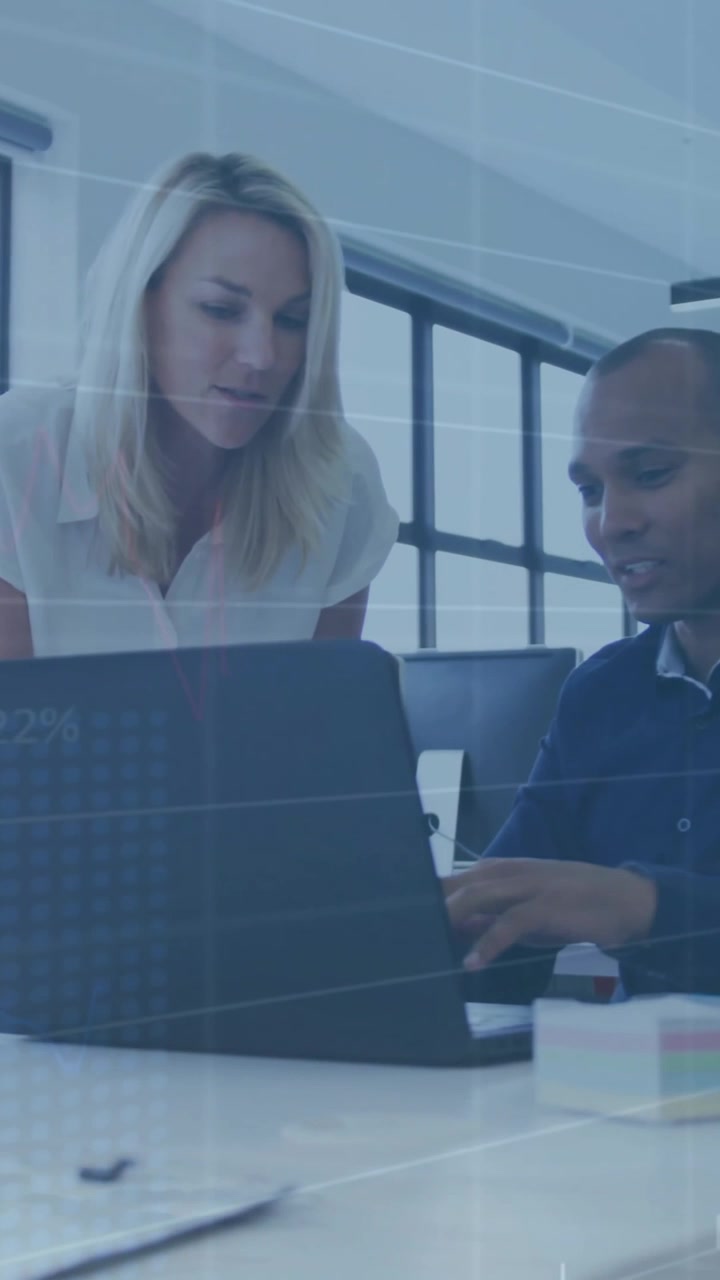 Animation of financial data processing over diverse colleagues using laptop in office