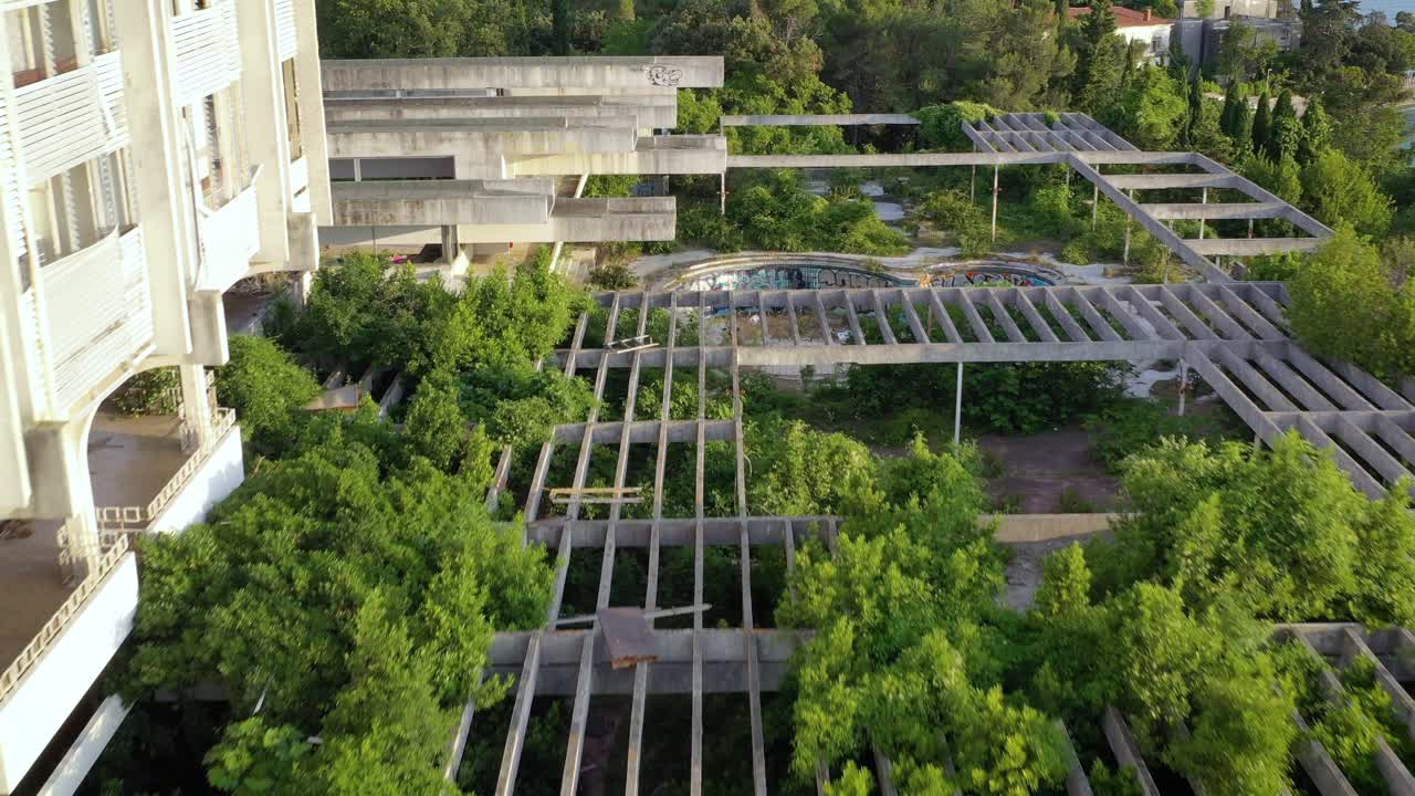 Low flyover above ruins of outer courtyard of old Haludovo Palace Hotel