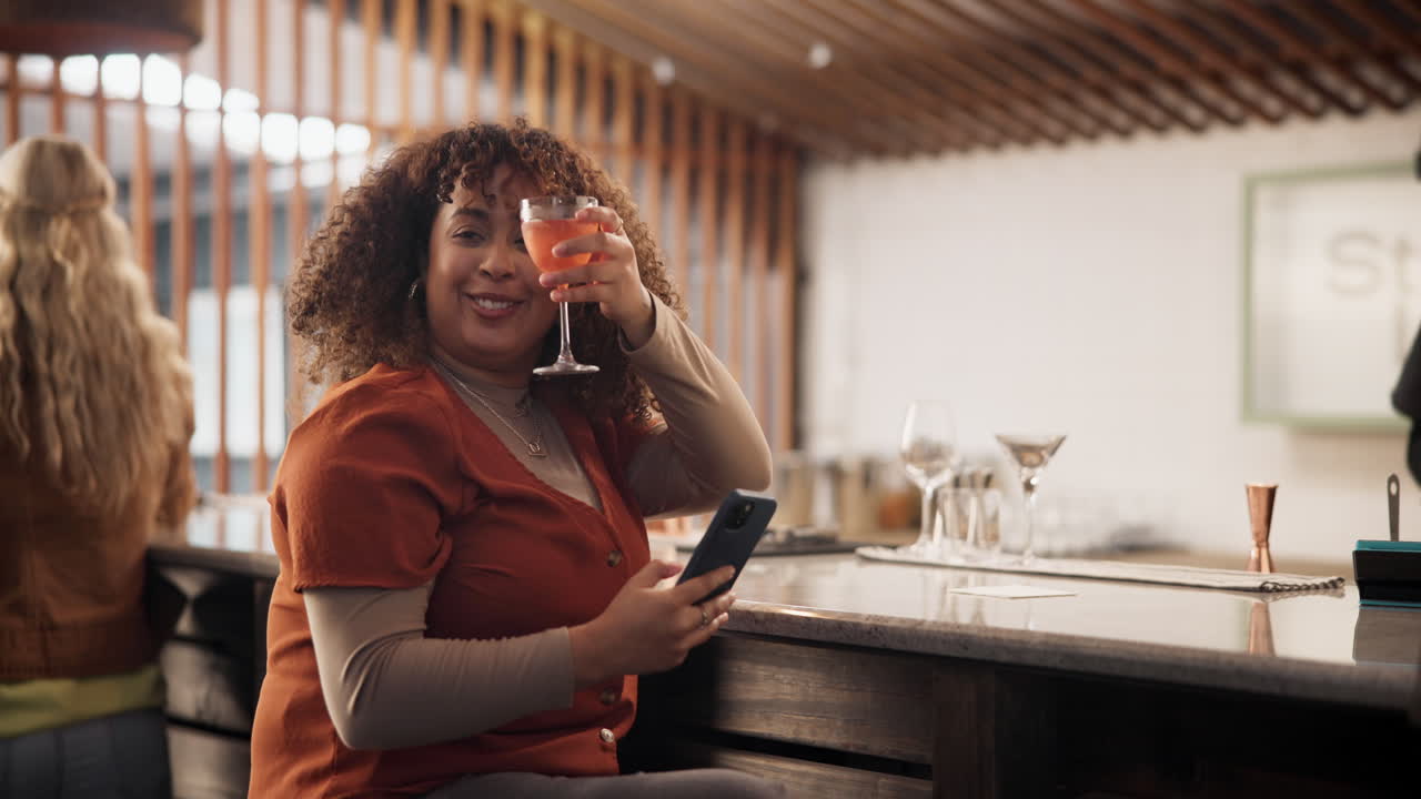 Woman enjoying a cocktail at a bar