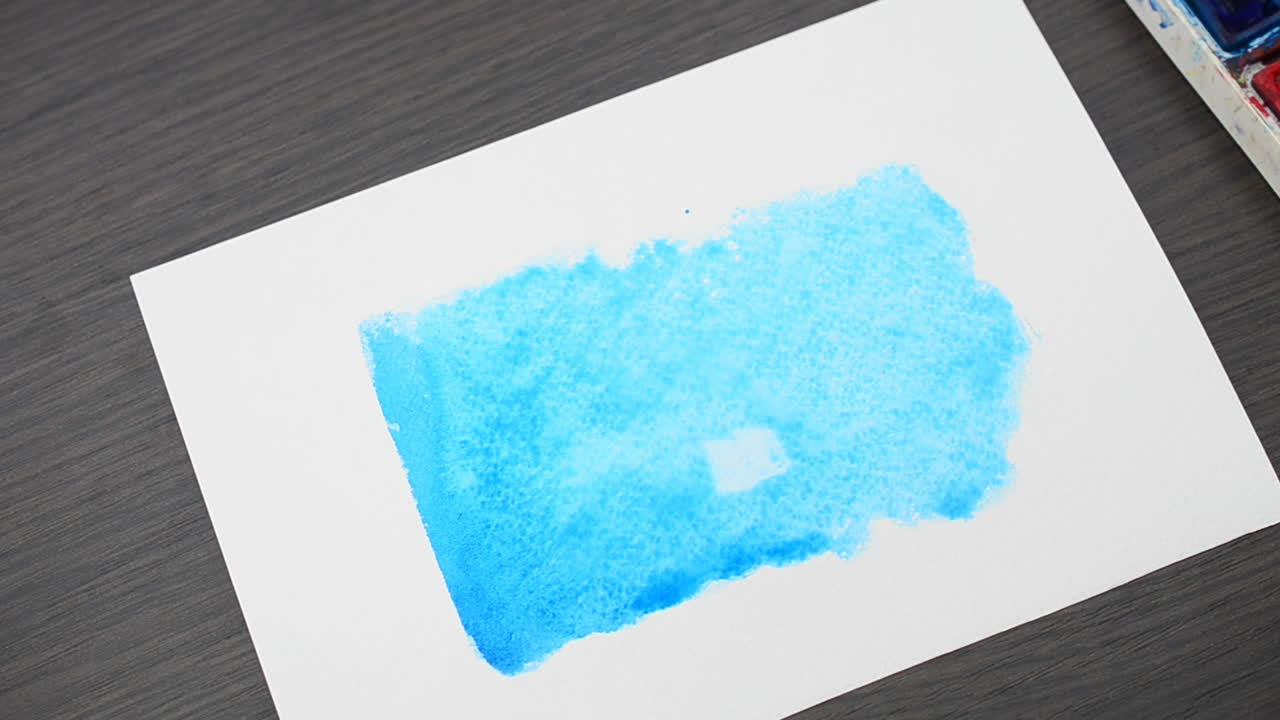 We draw the house on a blue background. We draw water color paints