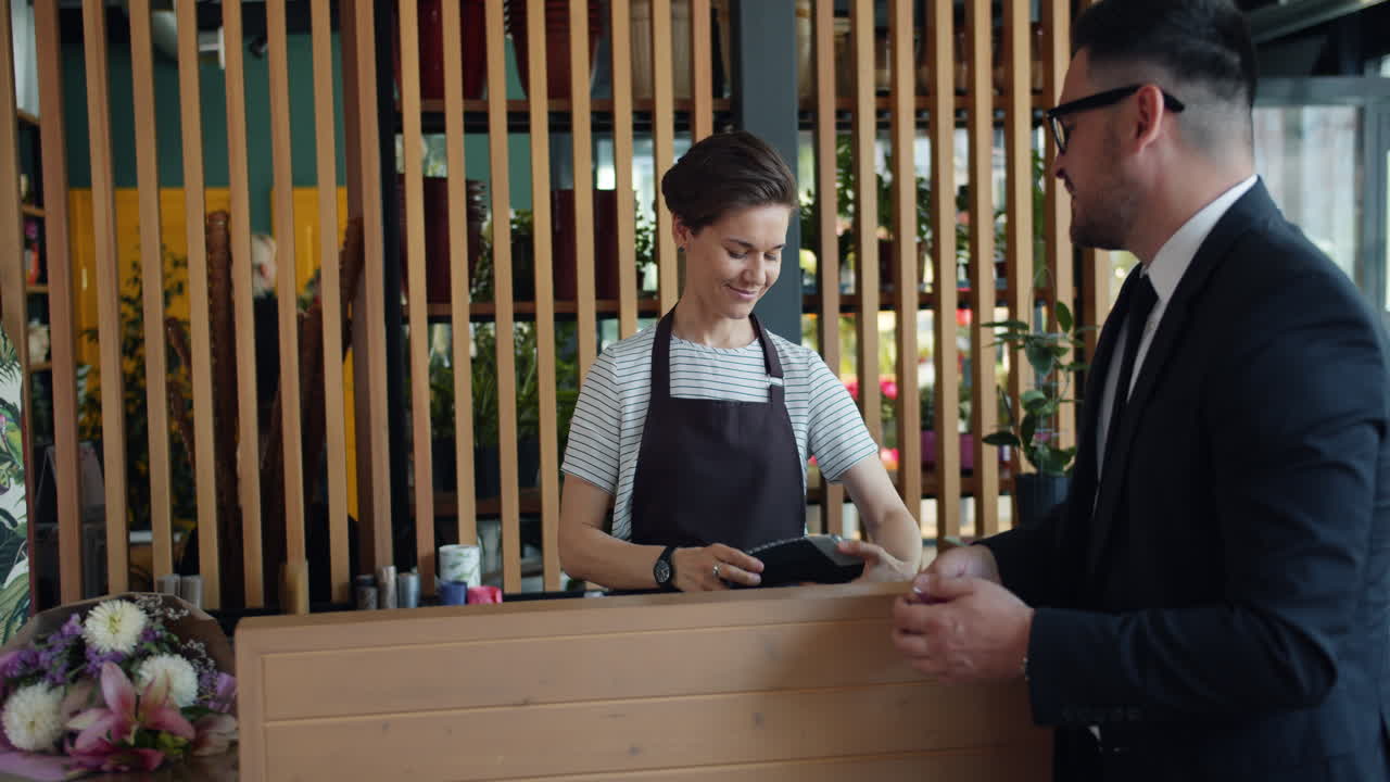 Customer purchasing flowers at a flower shop