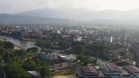 aerial view of morning sunrise misty air over vang vieng in laos