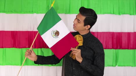 handsome latino model with the flag of mexico