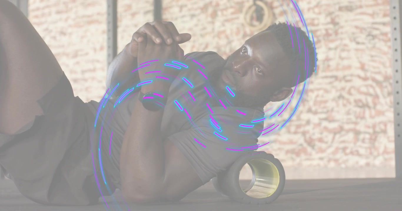 Man lifting hips and rolling foam roller for fitness recovery with digital swirl pulsing
