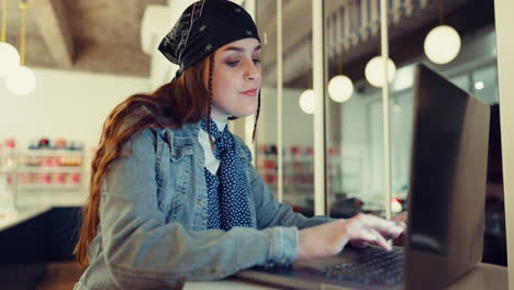 woman, typing and laptop at cafe