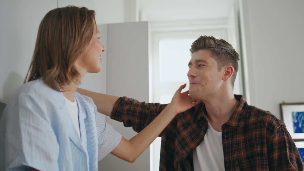 Lovely couple resting kitchen in morning closeup. Smiling woman touching man
