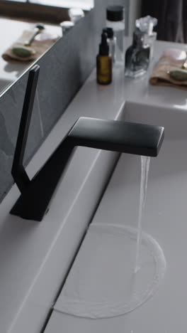 modern bathroom sink with black faucet