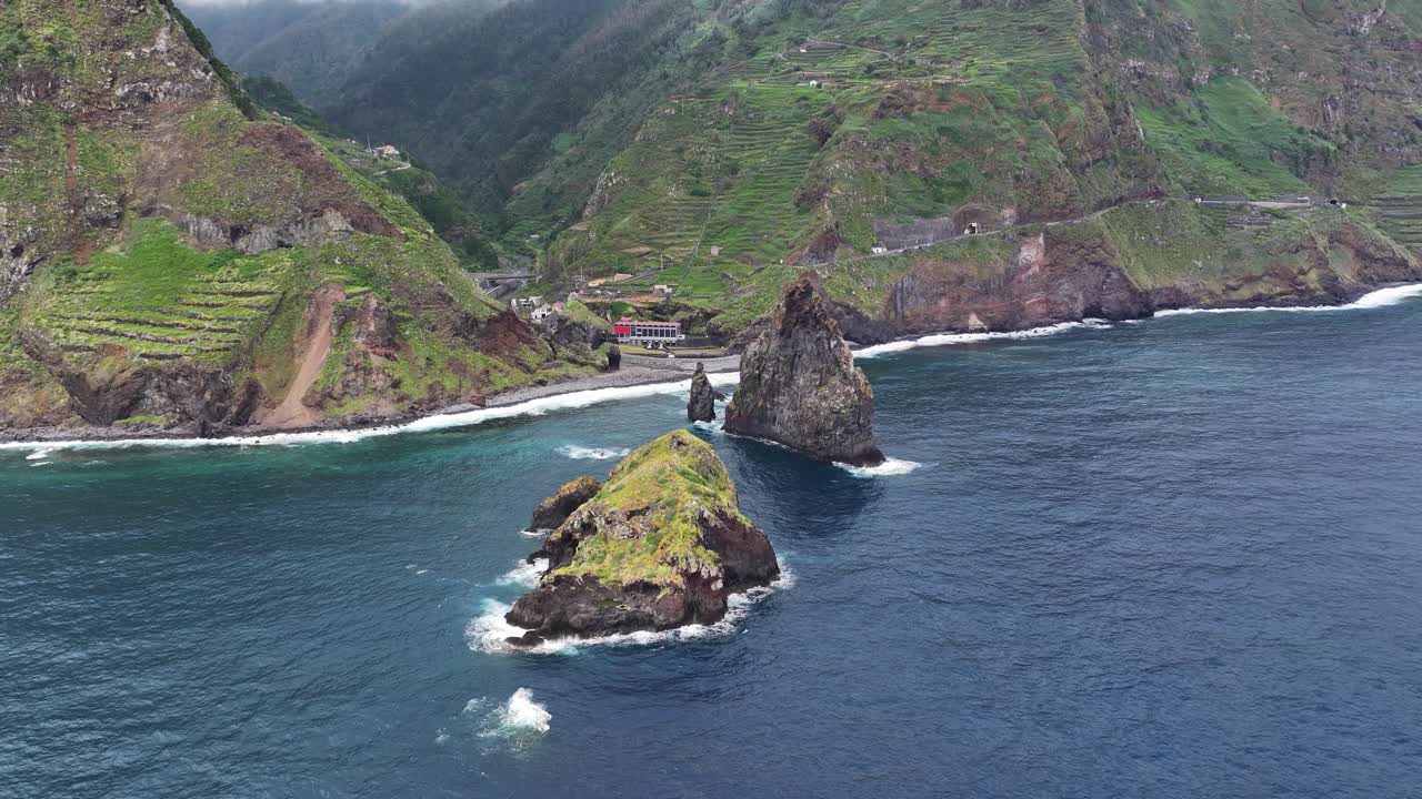 Ilhéus da Ribeira da Janela volcanic sea stacks near Porto Moniz, Madeira. Drone