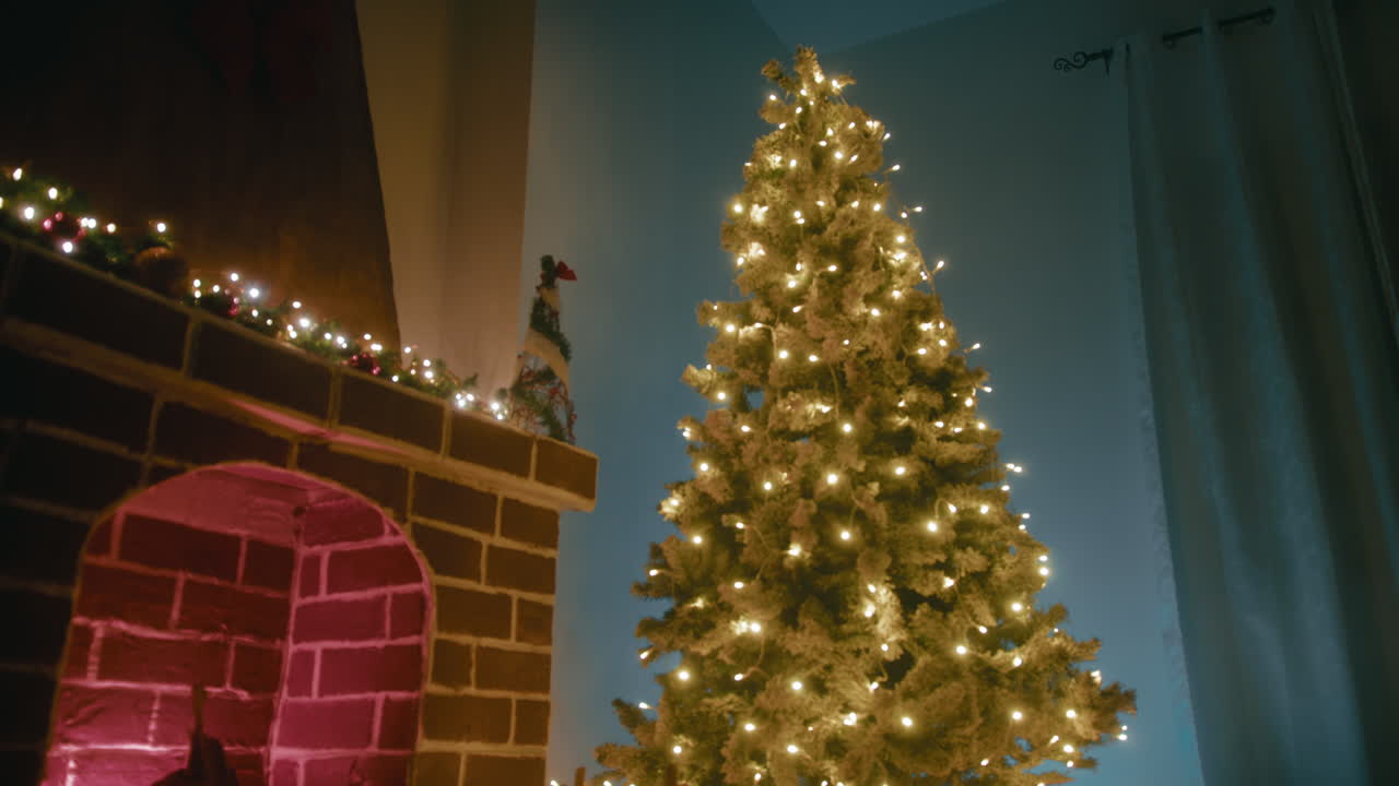 Christmas tree next to the fireplace in a cozy mountain home
