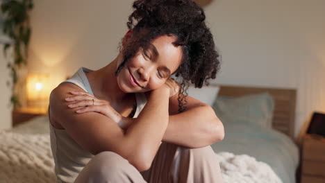 smiling woman sitting on a bed