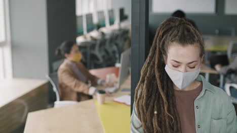 woman in office wearing mask