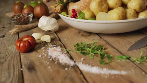 video of tray with roasted turkey, potatoes and spices on wooden surface