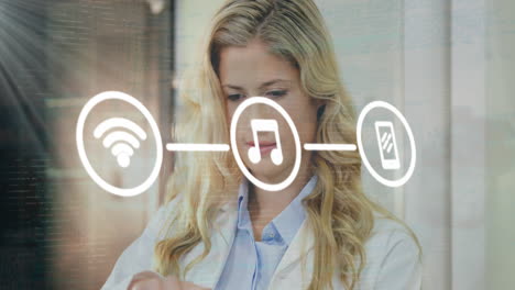 animation of network of digital icons against caucasian female doctor using laptop and smiling