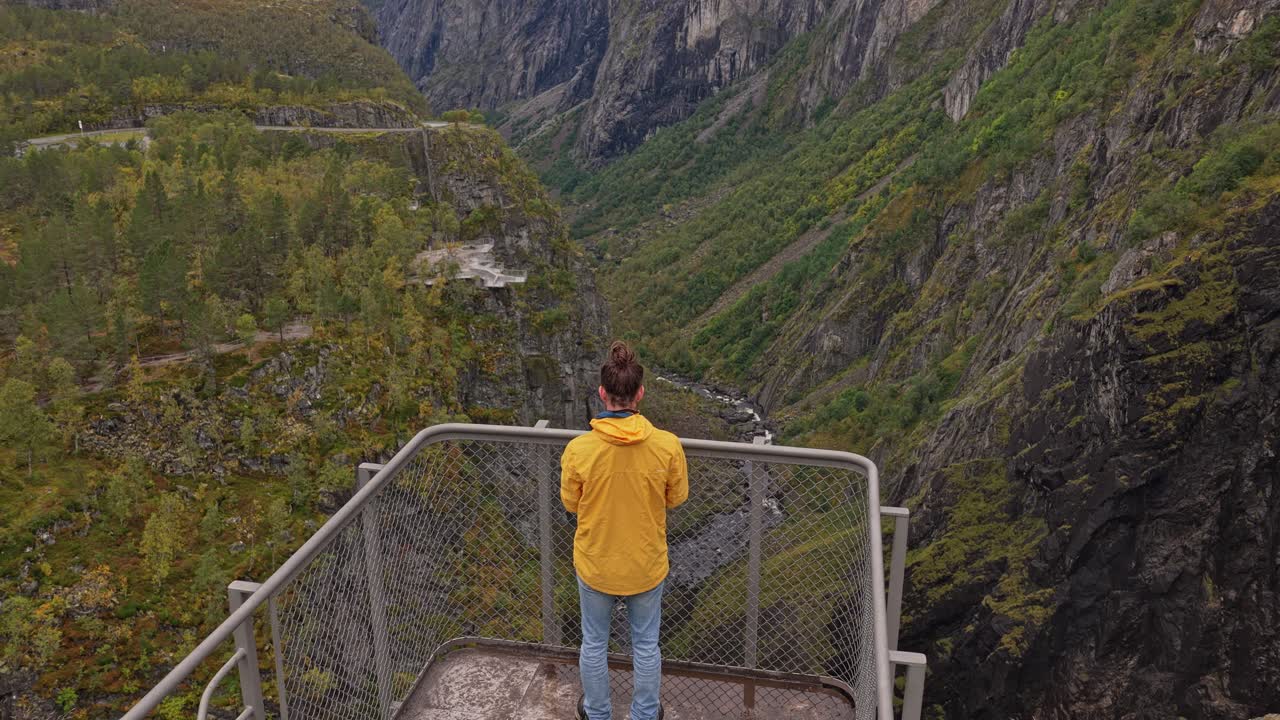 Topdown view of visitors walking along Voringfossen cliffs, Norway