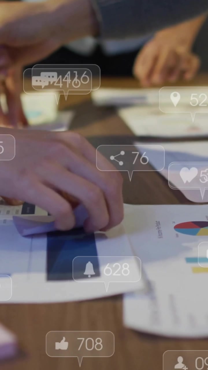 Organizing charts and graphs on table with animation of social media icons