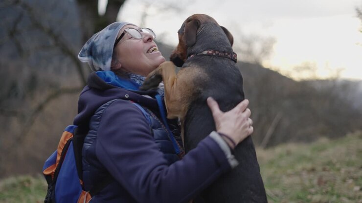 Woman Hiking with her Dog in the Outdoors