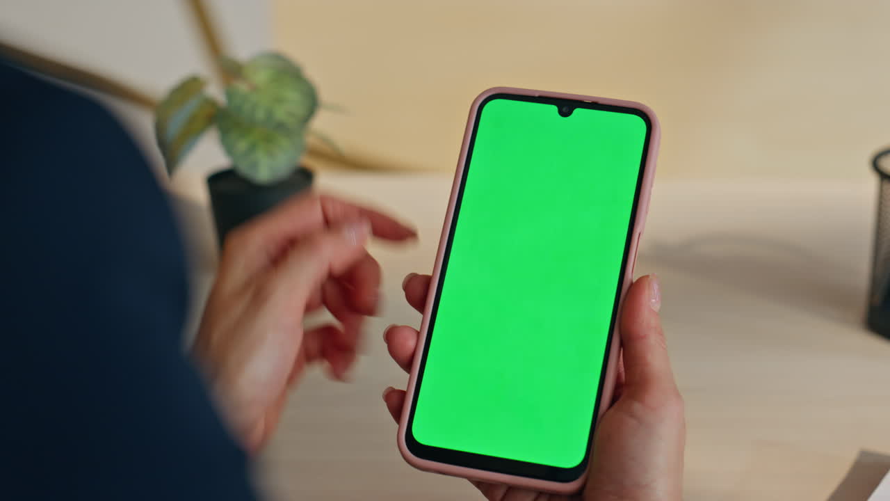 Director finger swiping mockup smartphone touchscreen at home workplace closeup