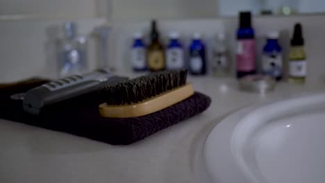 mens beard and hair care products-tools on a bathroom counter