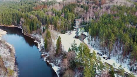 aerial view of anyksciai laju takas, treetop walking path complex with a walkway, an information center and observation tower, located in anyksciai, lithuania near sventoji river