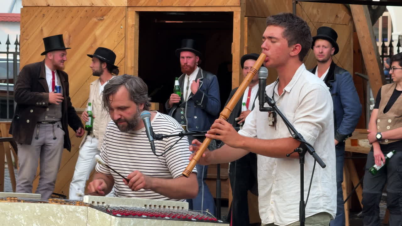 Sibiu, Romania, 17 July 2025: Church tower in Sibiu at sunset. The church tower rises above rooftops and trees in Sibiu at sunset