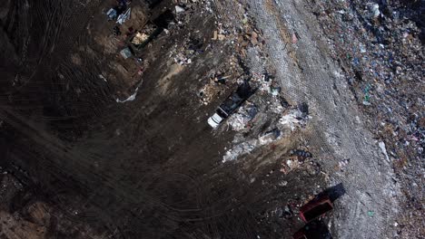 aerial view of truck dumping garbage at landfill in calgary se