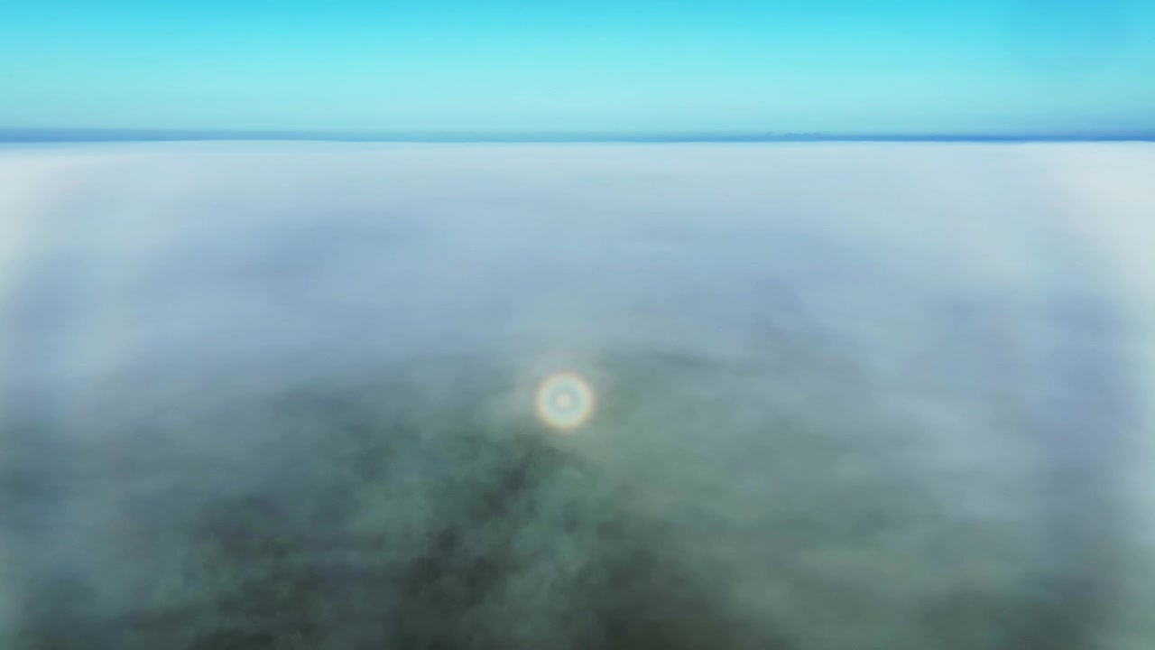 Drone follows the white fog bow and a rare weather phenomenon ringed glory in Saaremaa, Estonia.