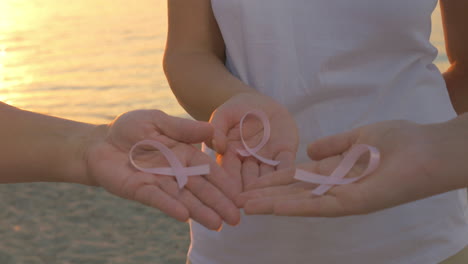 women with breast cancer awareness ribbons