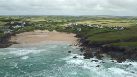 aerial shot of treyarnon bay in cornwall, england