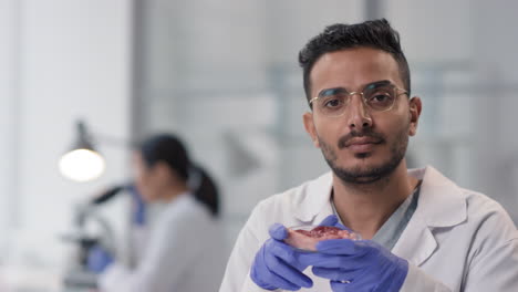 scientist examining meat sample in lab