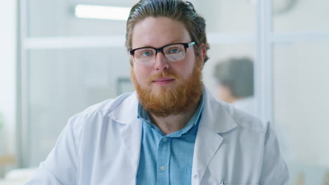 portrait of young male doctor at workplace