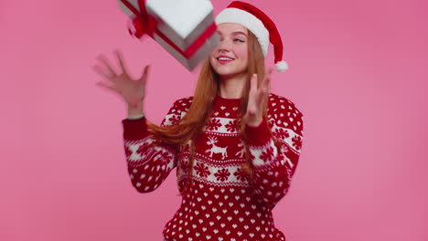 Cheerful-girl-in-Christmas-Santa-sweater-getting-present-gift-box,-expressing-amazement-happiness