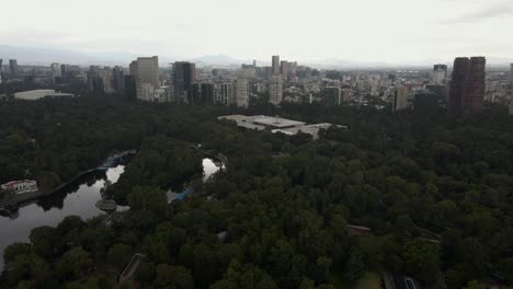 Chapultepec-park-green-recreational-zone-in-Mexico-City,-aerial-city-skyline