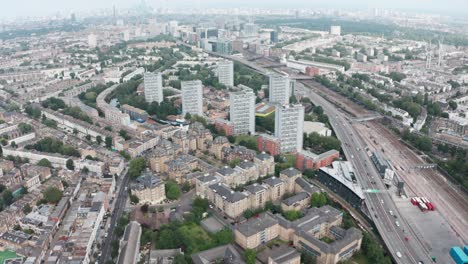 pan up drone shot towards city skyline from residential west london westway