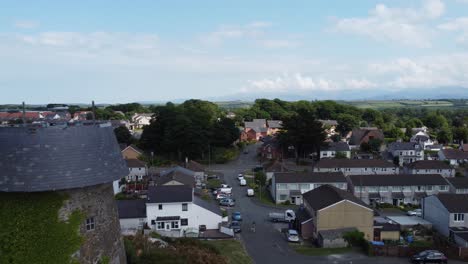 melin wynt y craig disused llangefni windmill ivy covered hillside landmark aerial reverse view, anglesey