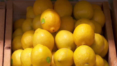 fresh lemons in wooden crate