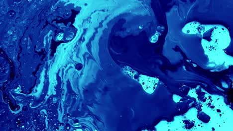 blue watercolor ink in water with oil. futuristic trend background.